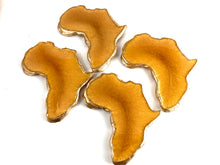 Load image into Gallery viewer, Mini Set of African Shaped Coasters in Sunset and Trimmed in Gold.
