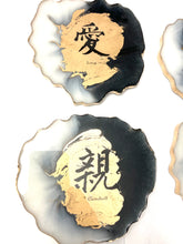 Load image into Gallery viewer, Geode Shaped Coaster with Chinese Characters in White, Black, and Gold.  Love, Goodwill, Peace, and Joy
