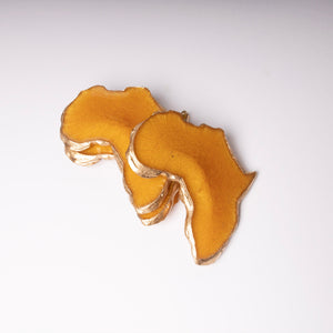 Mini Set of African Shaped Coasters in Sunset and Trimmed in Gold.