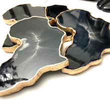 Load image into Gallery viewer, African Shaped Coasters in Black and White with Gold Trim
