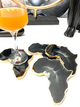 Load image into Gallery viewer, African Shaped Coasters in Black and White with Gold Trim
